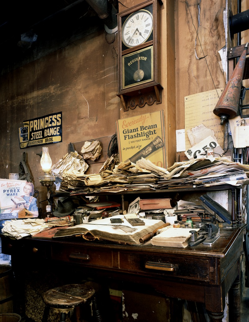 Cluttered_desk_at_the_historic_Harrison_Brothers_Hardware_in_Huntsville,_Alabama,_whose_shelves,_resembling_an_old-time_general_store,_are_equally_crammed_with_an_assortment_of_vintage_as_well_as_LCCN2011634695.tif.jpg